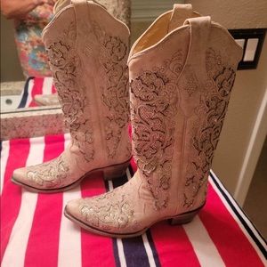A pair of corral Cowgirl boots